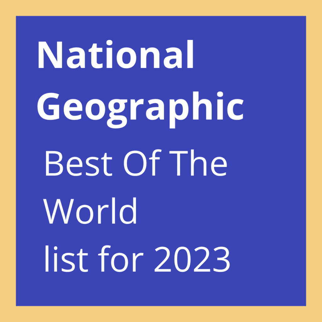A blue square with the text "National Geographic Best Of The World list for 2023" in bold and regular white font, set against a tan background—highlighting Manchester’s inclusion.