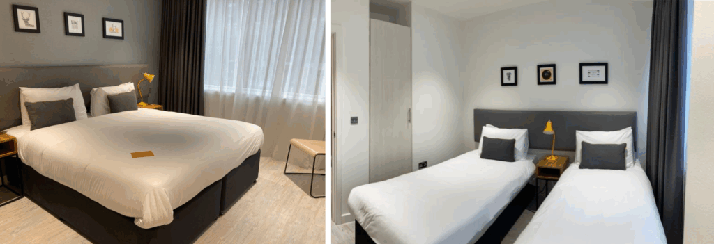 Fotos lado a lado mostram uma acomodação tipo estúdio com cozinha: um quarto de hotel com uma cama de casal grande à esquerda e o mesmo quarto com duas camas de solteiro à direita, ambos com decoração neutra e móveis modernos.